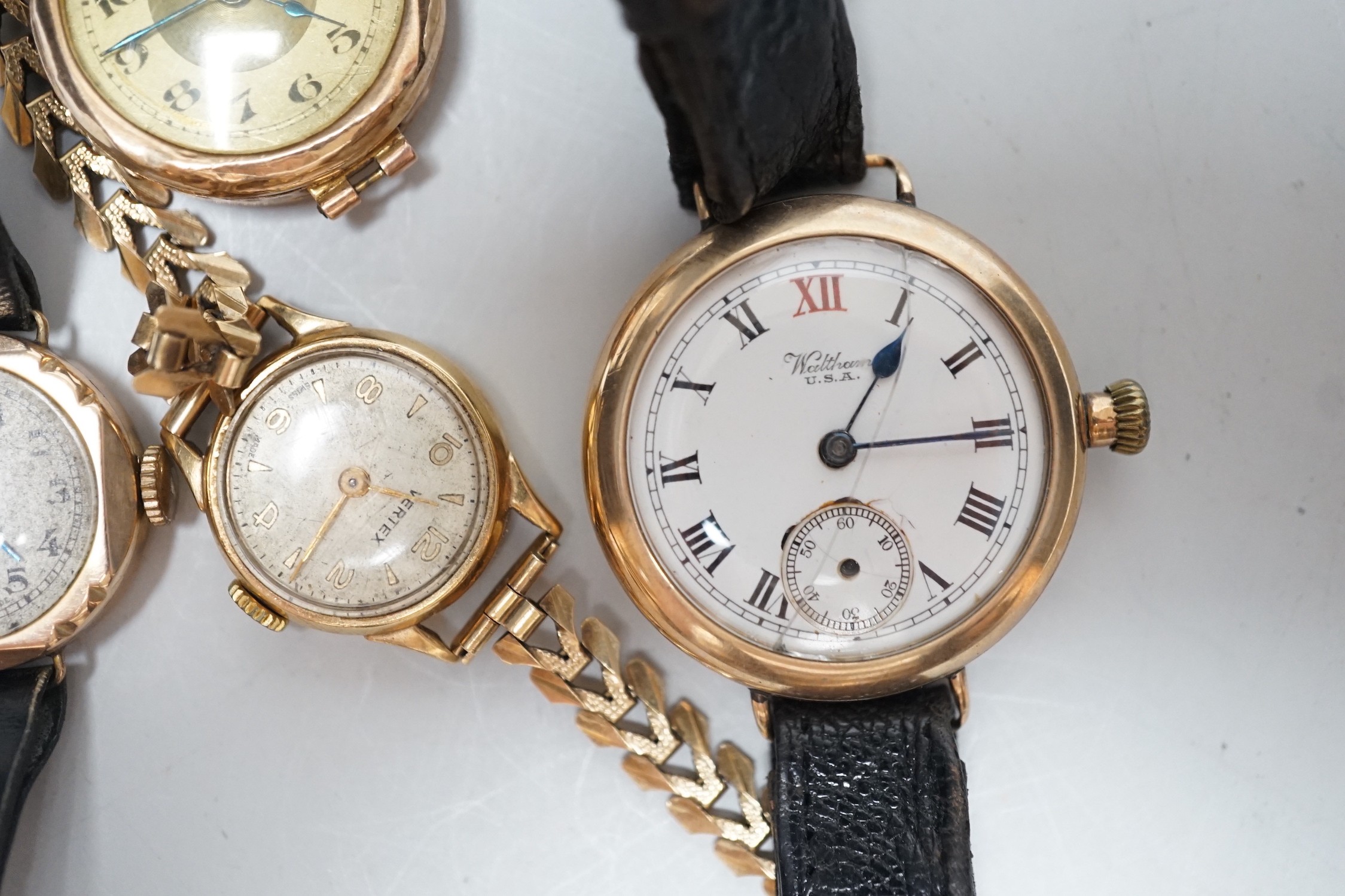 A lady's 9ct gold Timex manual wind wrist watch, on a 9ct gold bracelet, gross weight 1.8 grams and three other yellow metal wrist watches including a 9ct gold Waltham.